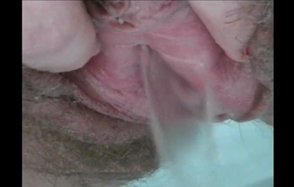 Girl showed her long labia and pissed after in close up